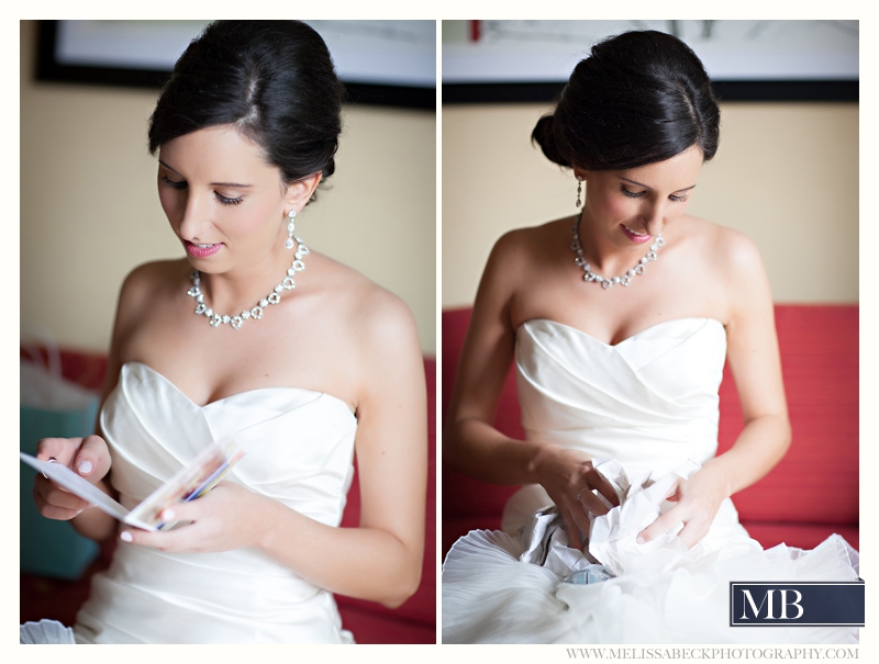 bride reading a love note on her wedding day