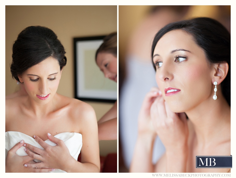 bride putting on her wedding day earings