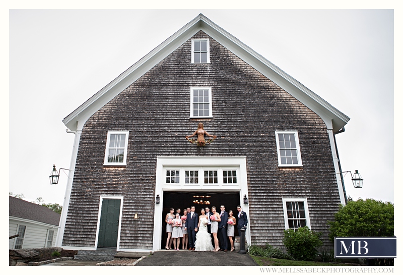 wedding party portraits in front of a gray barn at Mt Hope Farms