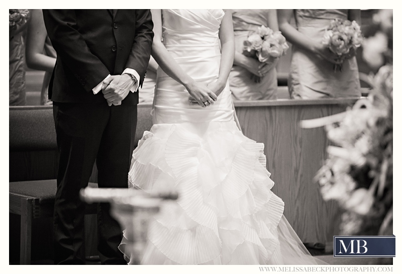 bride and groom hands folded