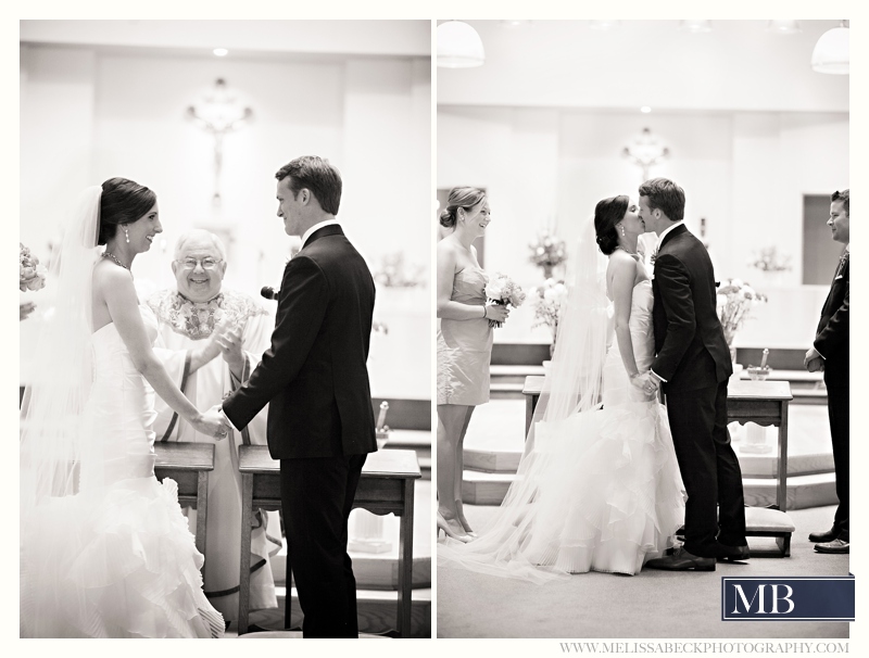 Bride and groom first kiss at a church wedding