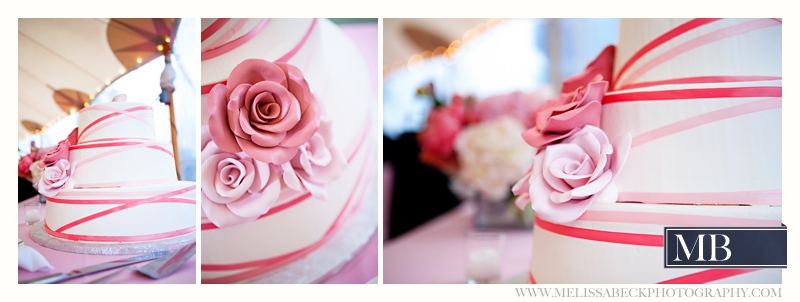 pink and white striped wedding cake with pink flowers