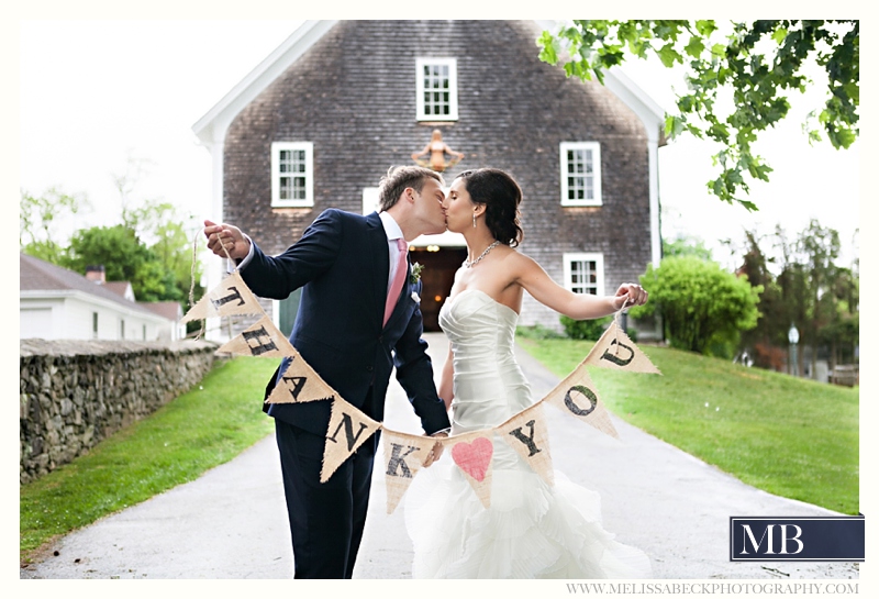 bride and groom thank you in front of gray barn at mt hope farms