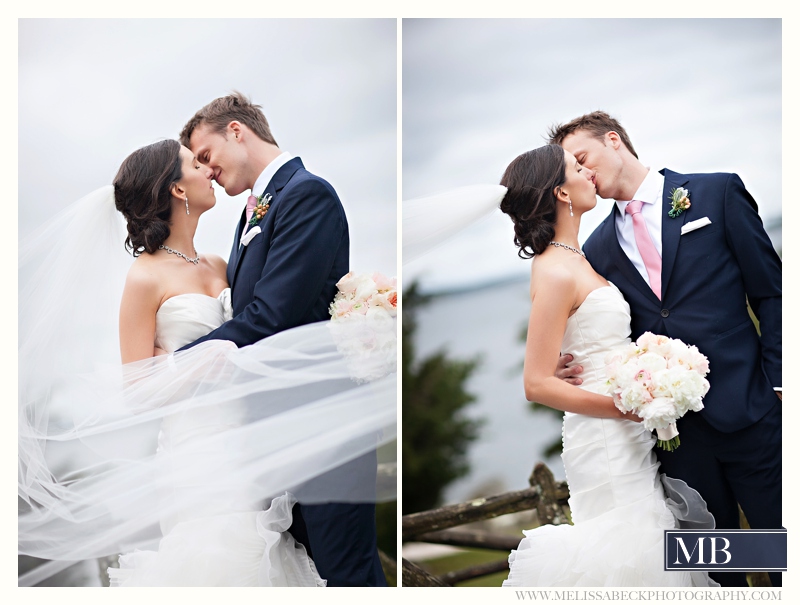 bride and groom smiling with long flowing veil