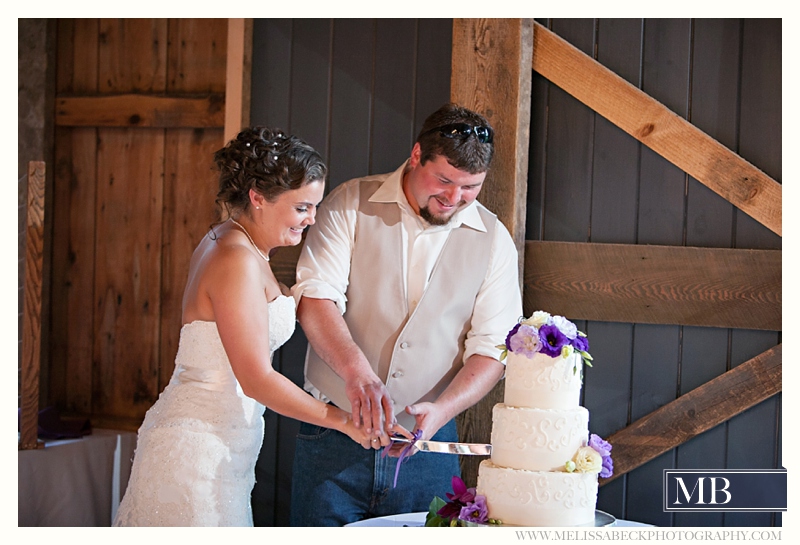 cutting the cake the barn at flanagn farm maine wedding